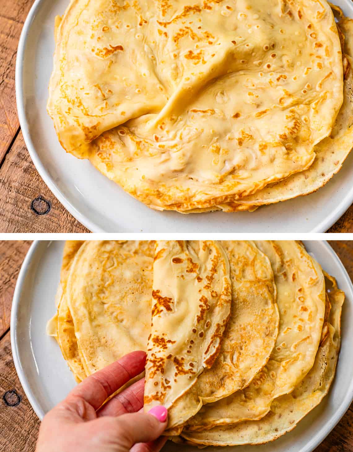 crepes stacked on a white plate, then folded over by someone's hand.