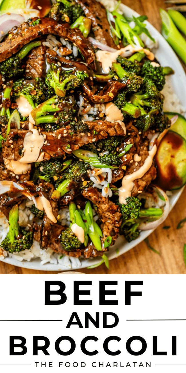 overhead shot of white plate with strips of beef and broccoli florets with cucumber garnish.