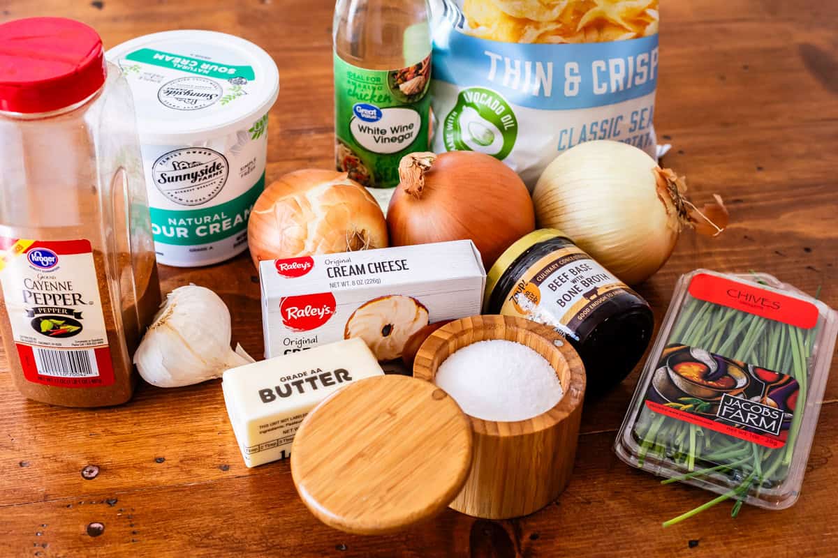 ingredients for french onion dip - cream cheese, onions, beef base, sour cream, and more.
