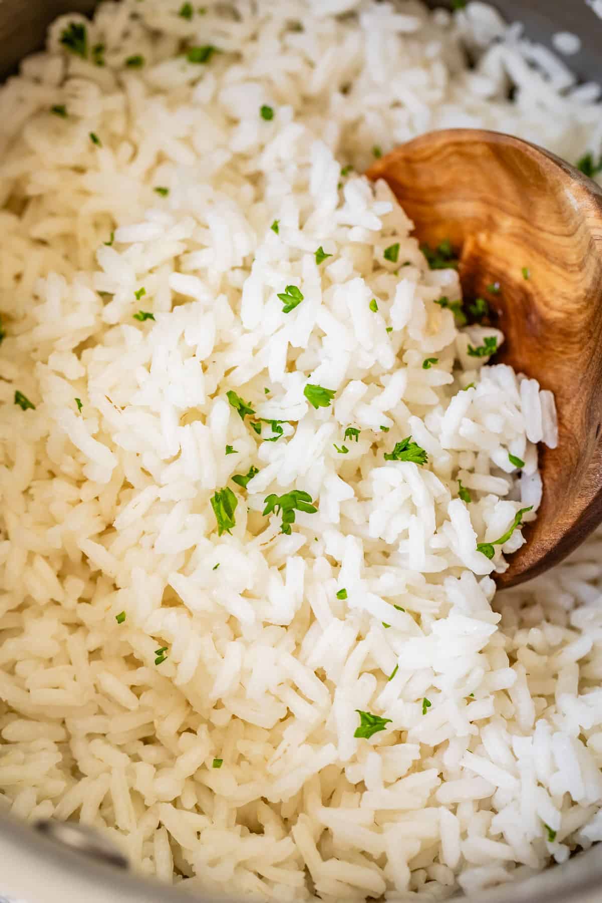 Close of up basmati white rice in a metal pot.