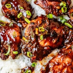 5 large chicken thighs in honey garlic sauce and green onion served over white rice.