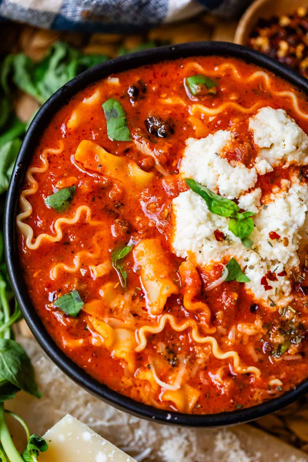ceramic bowl on counter filled to the top with homemade easy lasagna soup.