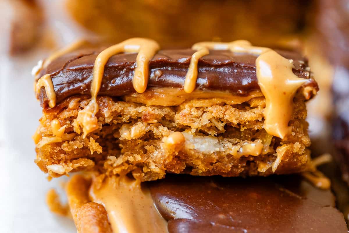 lunch lady peanut butter bar side view to show layers, with peanut butter drizzled on top.