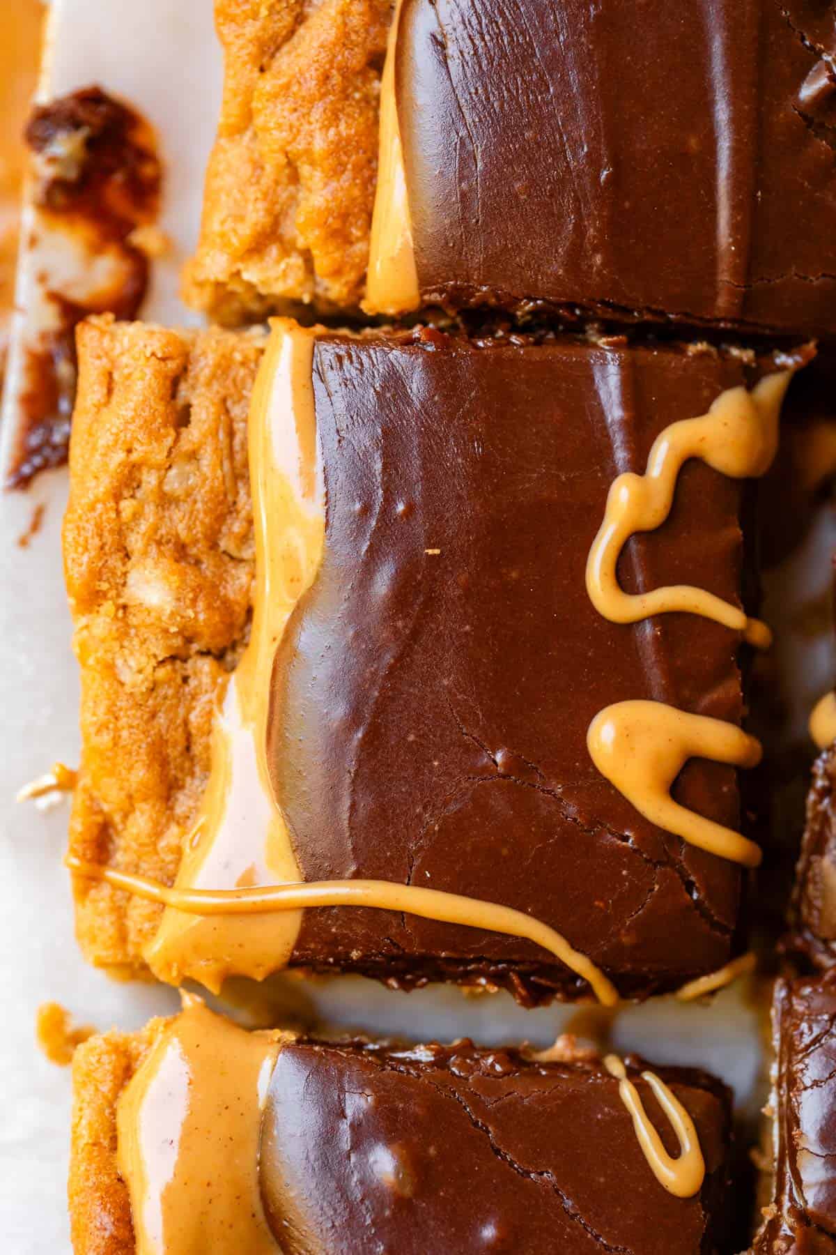 close up of one square of lunch lady peanut butter cookie bar with chocolate frosting.