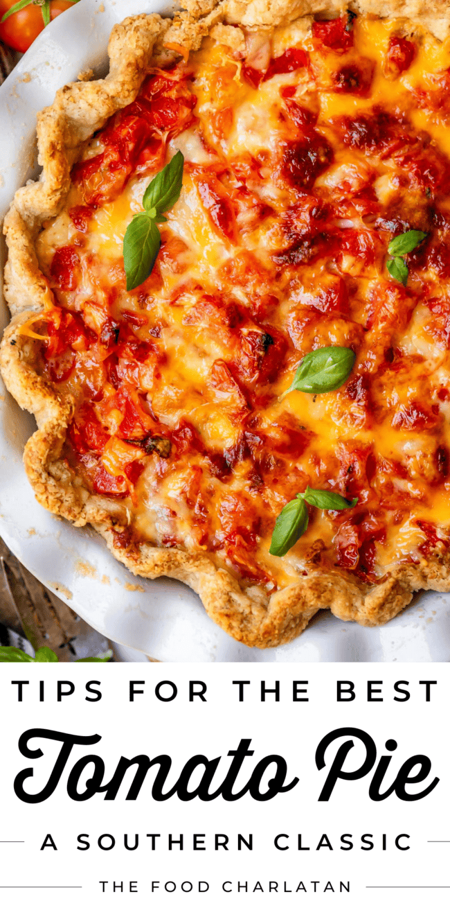 Pin image for tomato pie in pie pan with basil on top and flaky pie crust with basil.