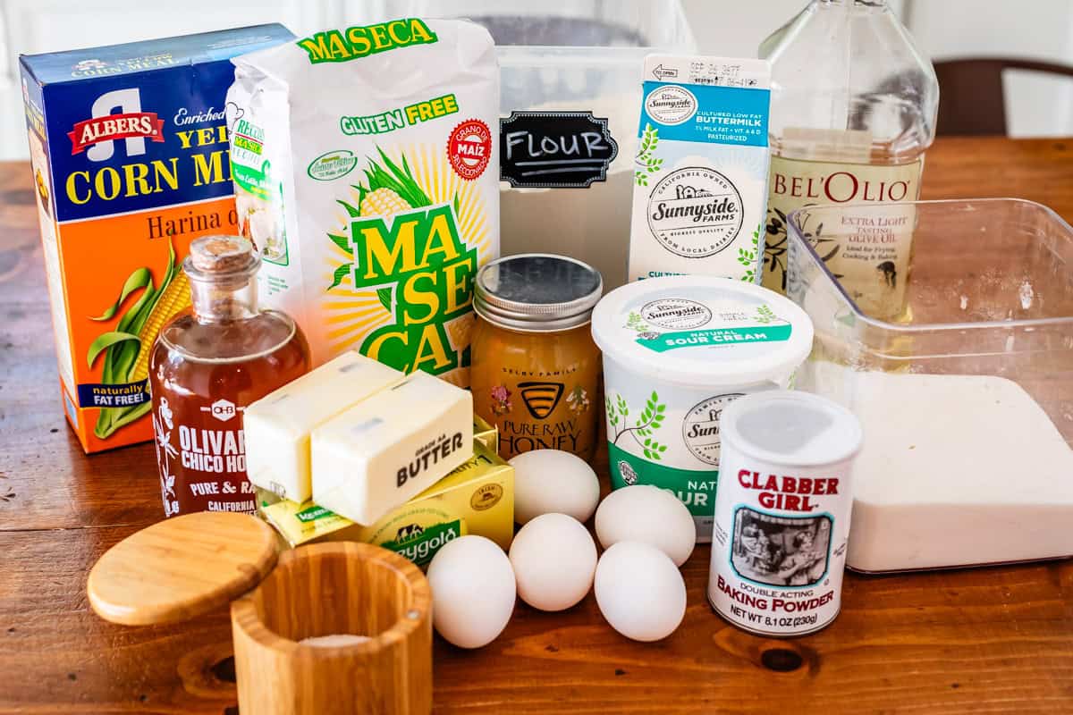 ingredients for cornbread cake like cornmeal and corn flour, raw honey, and more.