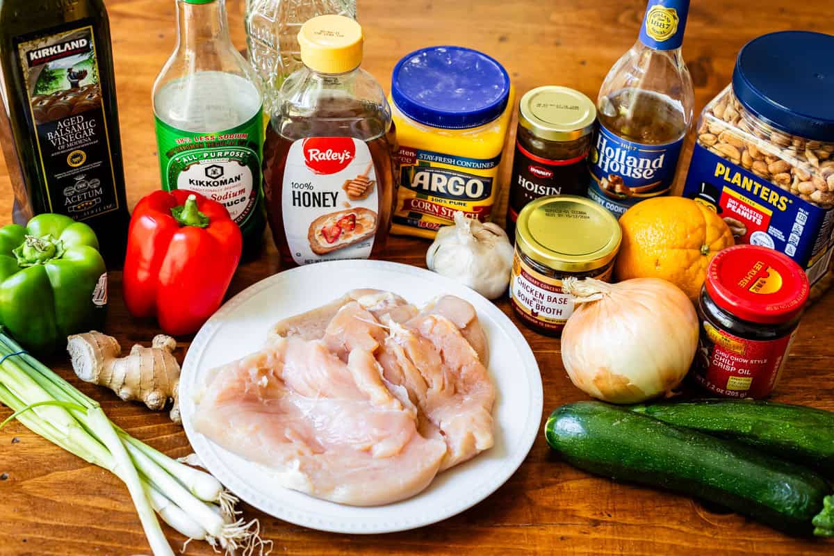 ingredients for kung pao chicken: veggies, chicken, peanuts, and sauce items.