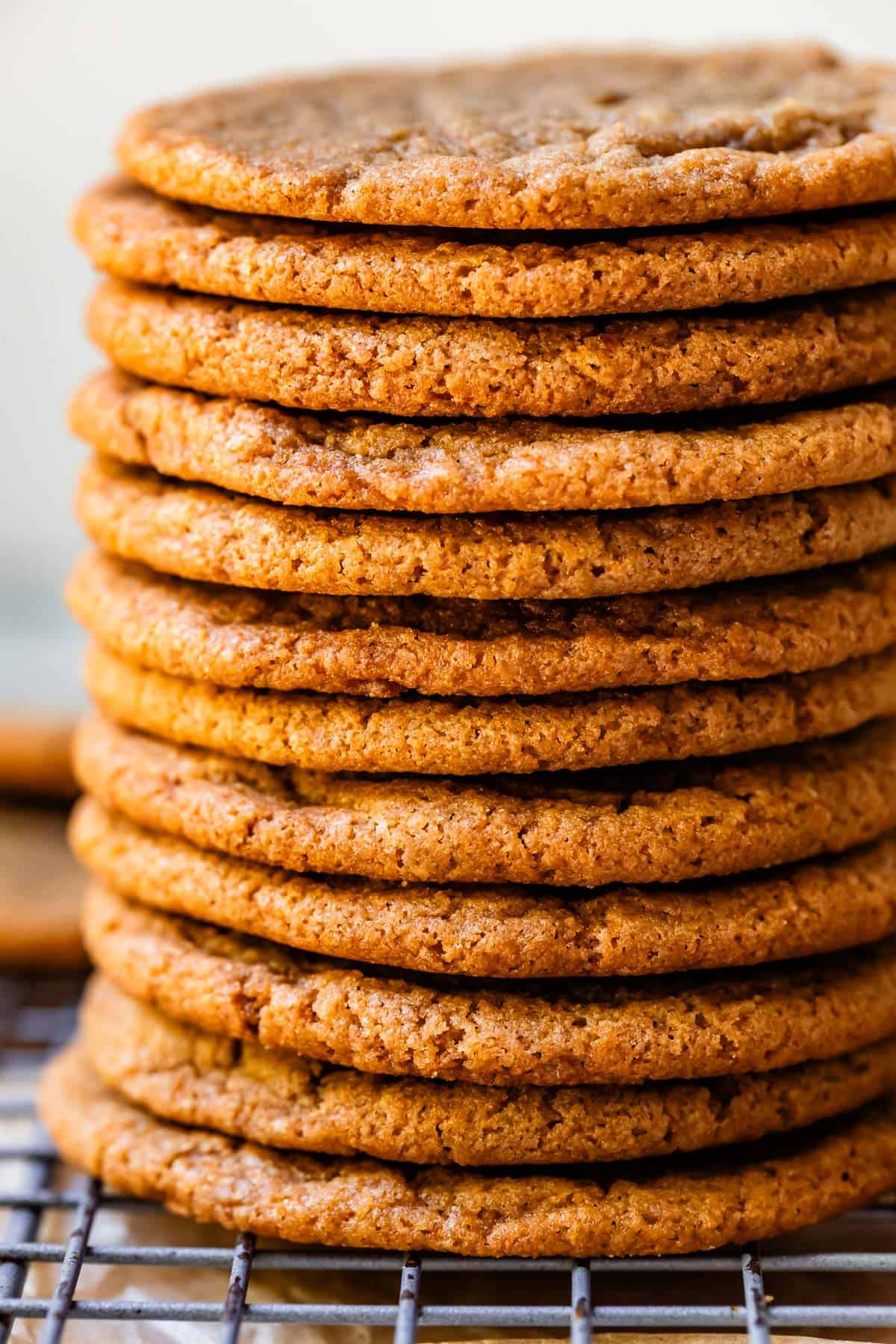 very tall stack of flat brown butter cookies with no filling in between them.