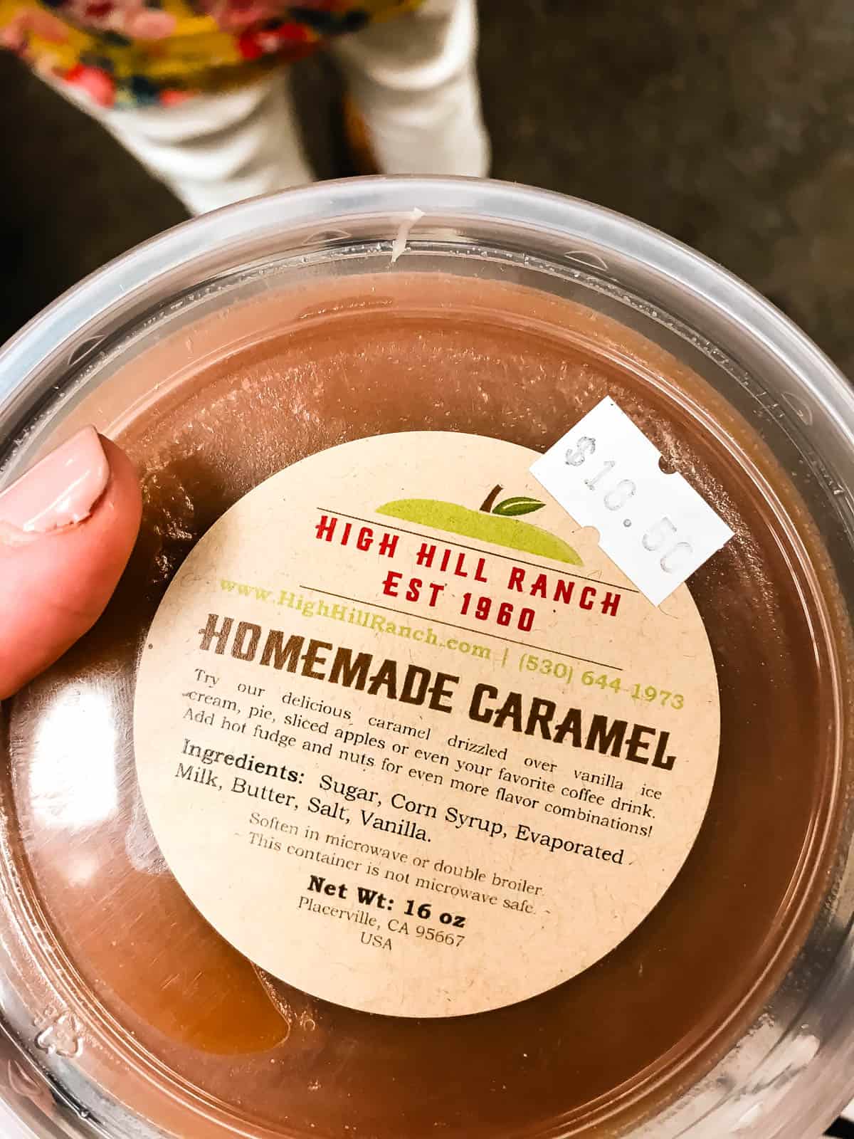 homemade caramel in a tub, showing the label.
