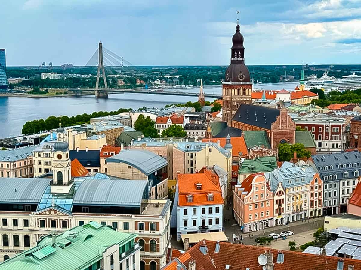 photo of Riga from high location, river, church, red roofs.