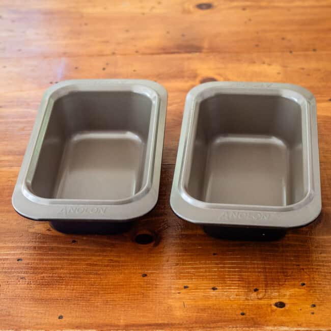 Analon loaf pans on wooden table.