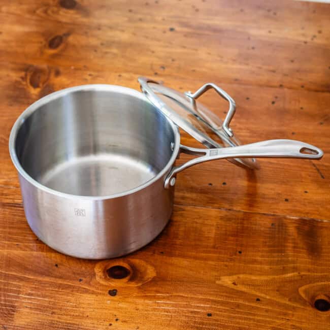 zwilling 3-quart sauce pan on wooden table.
