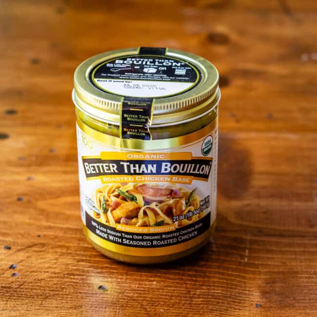 Better than bouillon chicken base on wooden table.
