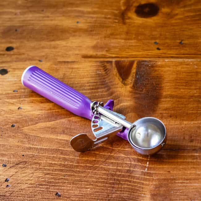 #8 Vollrath cookie scoop on wooden table.