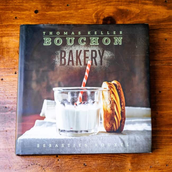 Copy of cookbooy bouchon bakery by thomas keller on wooden table.