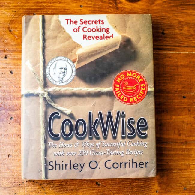 Copy of cookwise by shirley corriher on wooden table.