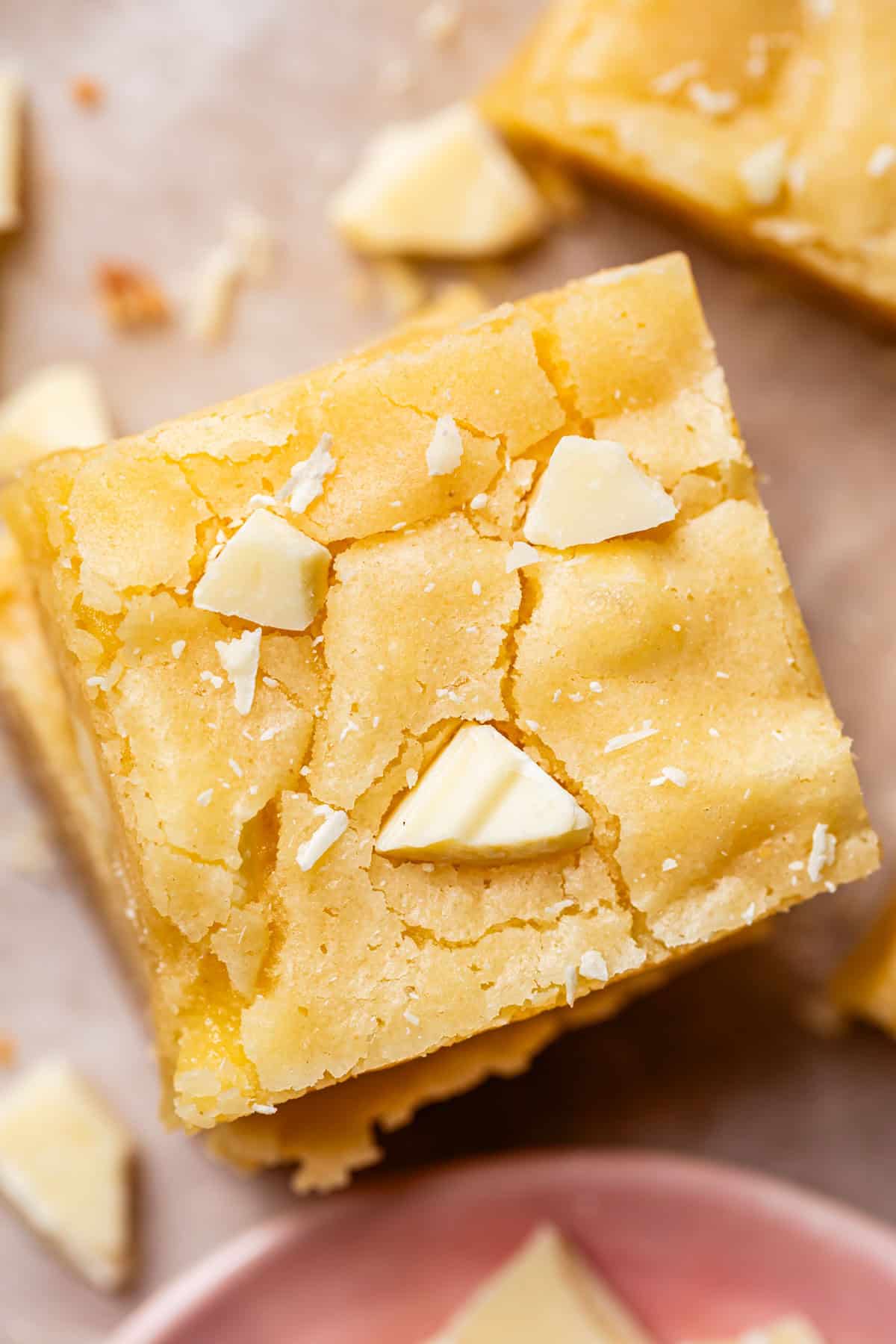 looking down at the top of a square piece of white chocolate brownies.