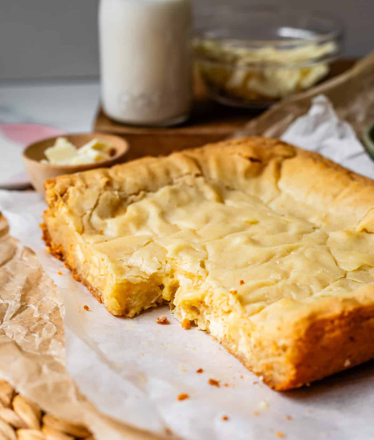 freshly baked white chocolate brownies with a section cut out.