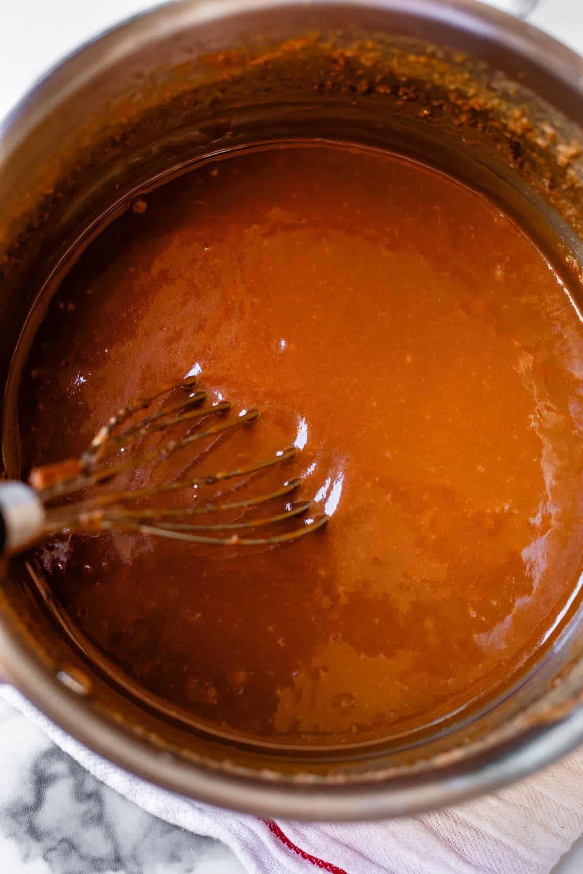 vertical, overhead shot of finished, smooth caramel in the pan.