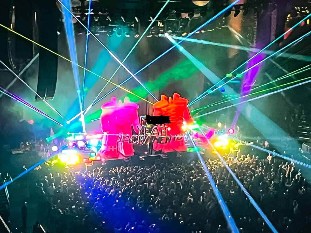 robots balloons at a concert with lights.