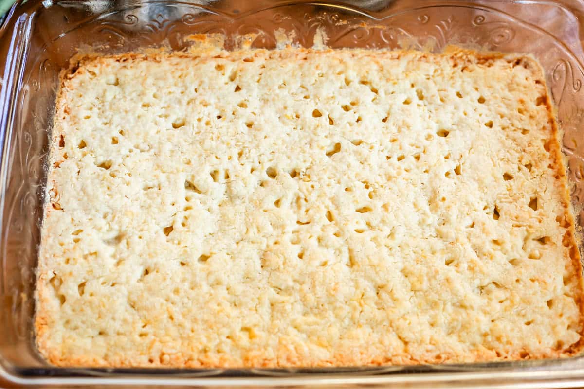 baked shortbread crust in a clear glass pan.