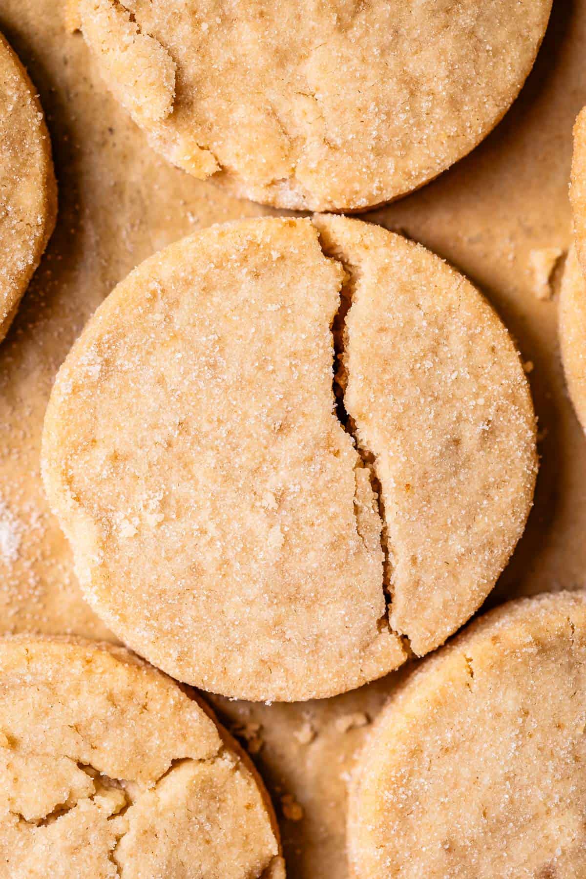 overhead shot of round shortbread cookie with a crack down the right side.
