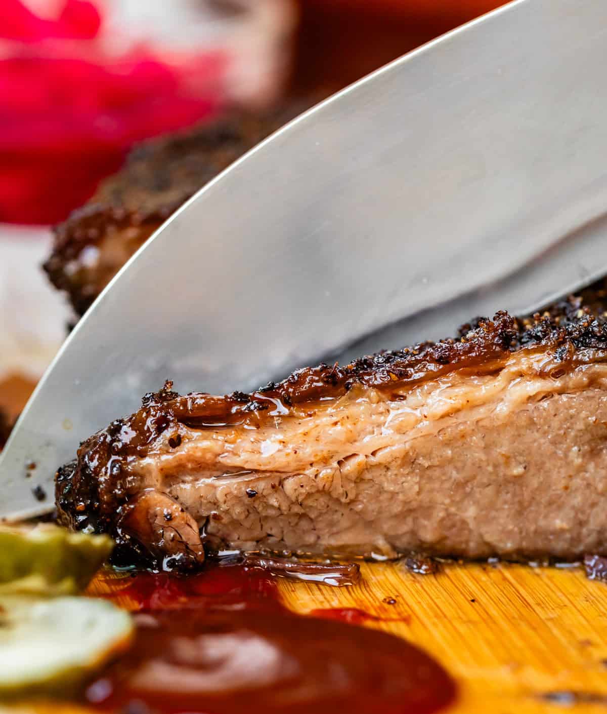 Slicing brisket with chef's knife.