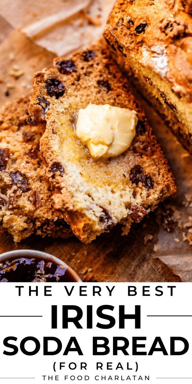 Raisin Irish soda bread cut into a slice with butter.