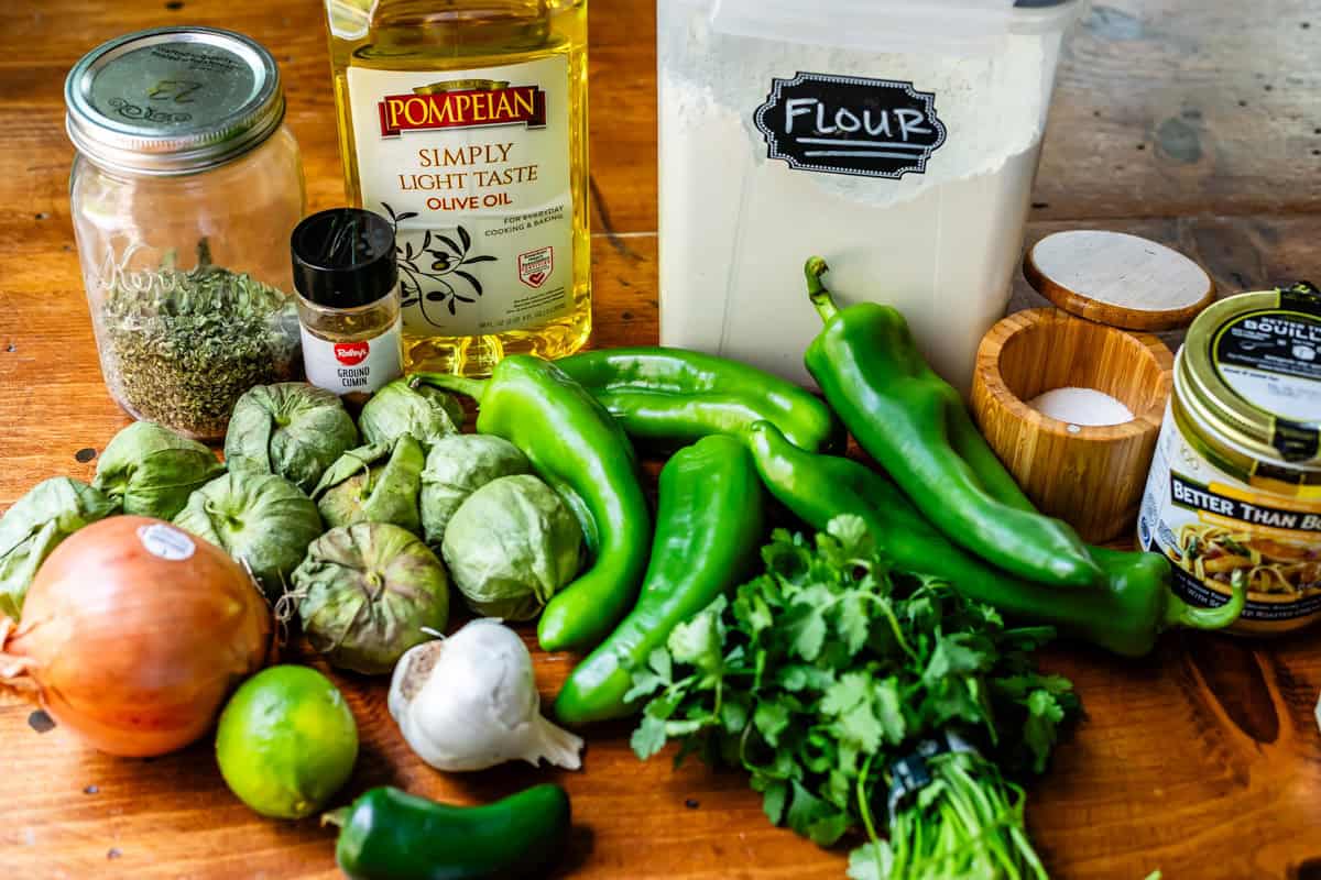 ingredients for green enchilada sauce like tomatillos, green peppers, and more.