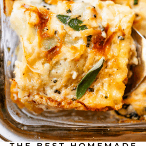 A close-up of a golden, cheesy butternut squash lasagna slice being served from a glass baking dish, topped with herbs. Text below reads, “The Best Homemade Butternut Squash Lasagna – The Food Charlatan.”.
