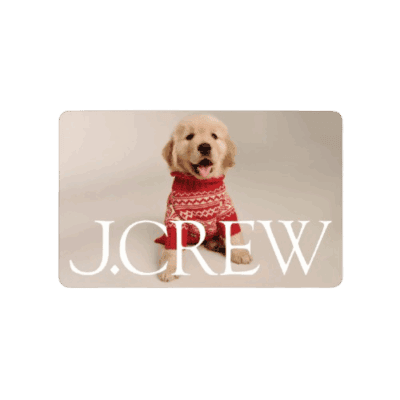 A golden retriever puppy wearing a red and white sweater sits on a light background. The text J.CREW is displayed in large white letters over the image.